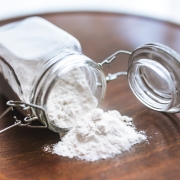 White flour or powder in a glass jar
