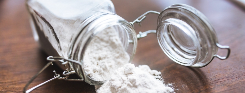White flour or powder in a glass jar