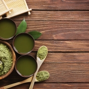 matcha green tea and matcha powder with bamboo and wooden spoons